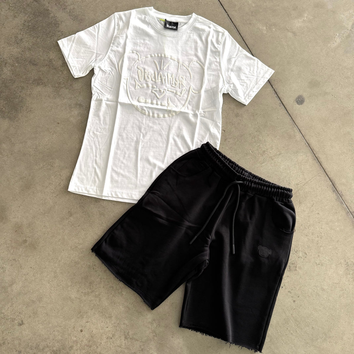 Outfit Disclaimer Bianco/Nero